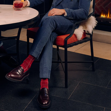 These socks are typically worn with dress shoes or formal attire, available in various colors, designs, and materials, adding flair to a man's outfit.