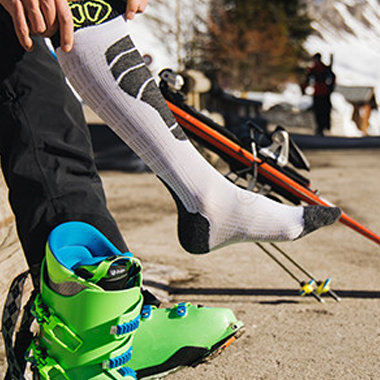 These socks are made for snowboarding or skiing, using moisture-wicking and insulating materials to keep feet dry, warm, and comfortable during winter sports.